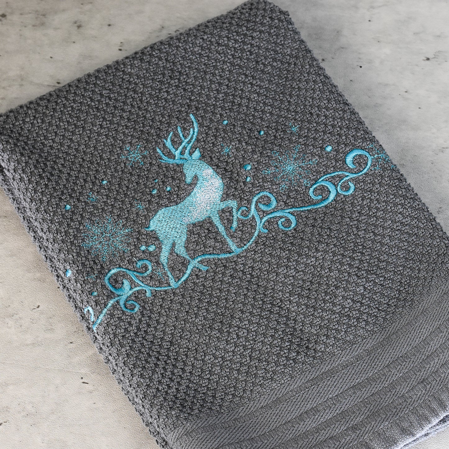 Embroidered Magical reindeer and snowflake hand towel made of 100% cotton waffle weave toweling