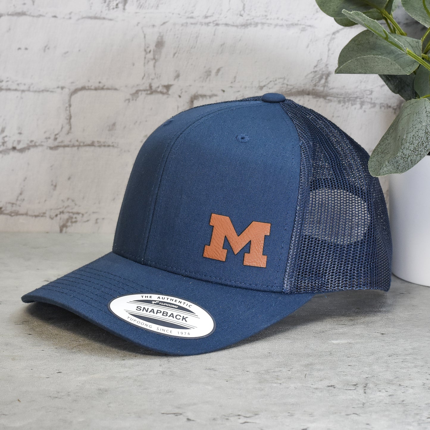 UM Block M Trucker Hat - Minimalist Custom Leatherette Logo