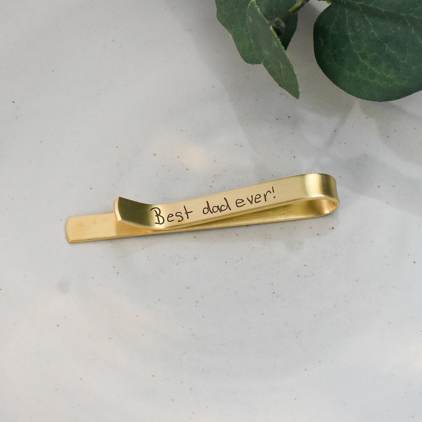 Custom engraved hand written message for dad on Father's Day engraved in gold brass.  Traditional tie accessory with personal touch.