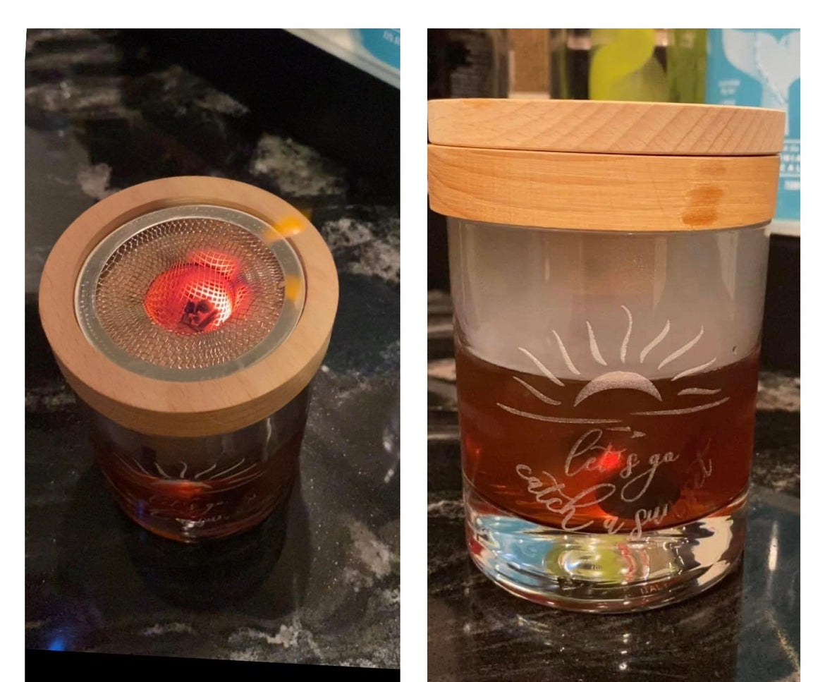 Custom logo glass with old fashion drink demonstrating use of smoking kit.