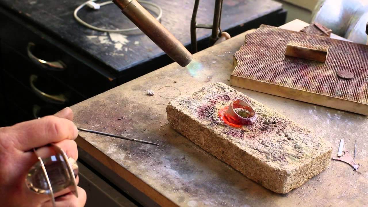 image of melting sterling silver on block for recycling into new jewelry designs